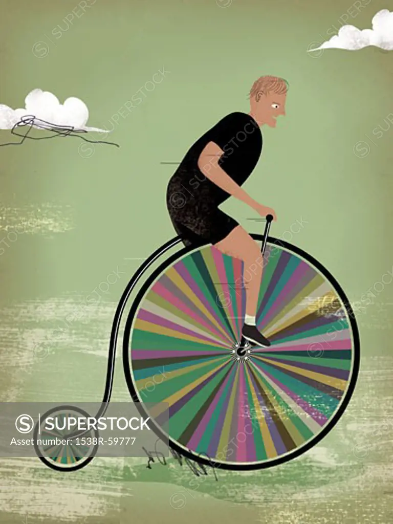 A man riding a rainbow colored penny farther