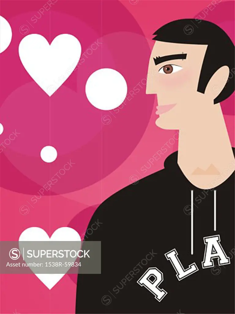 A man in a sweatshirt in front of rows of hearts