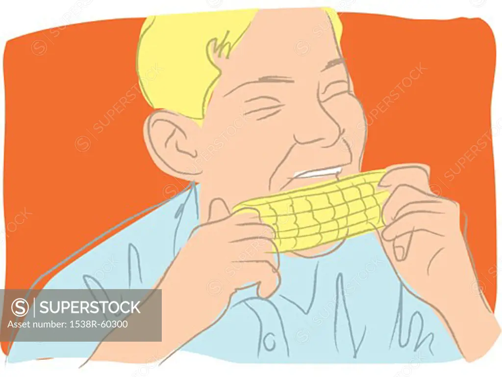 A boy eating corn on the cob