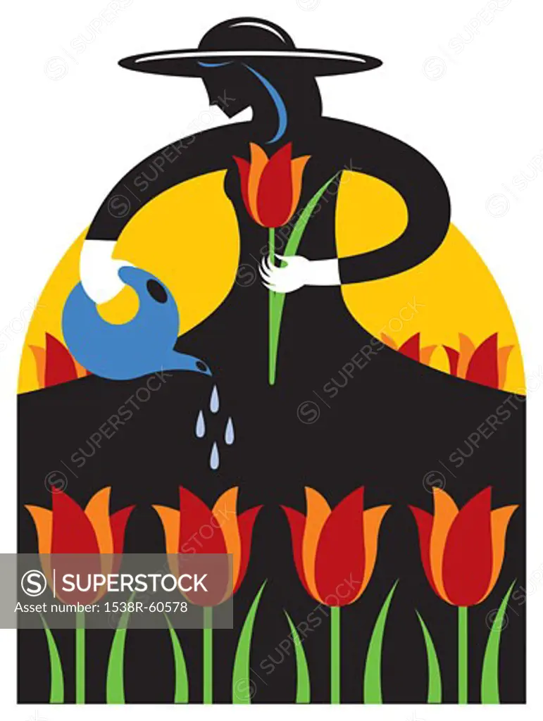 A woman watering flowers at a tulip festival