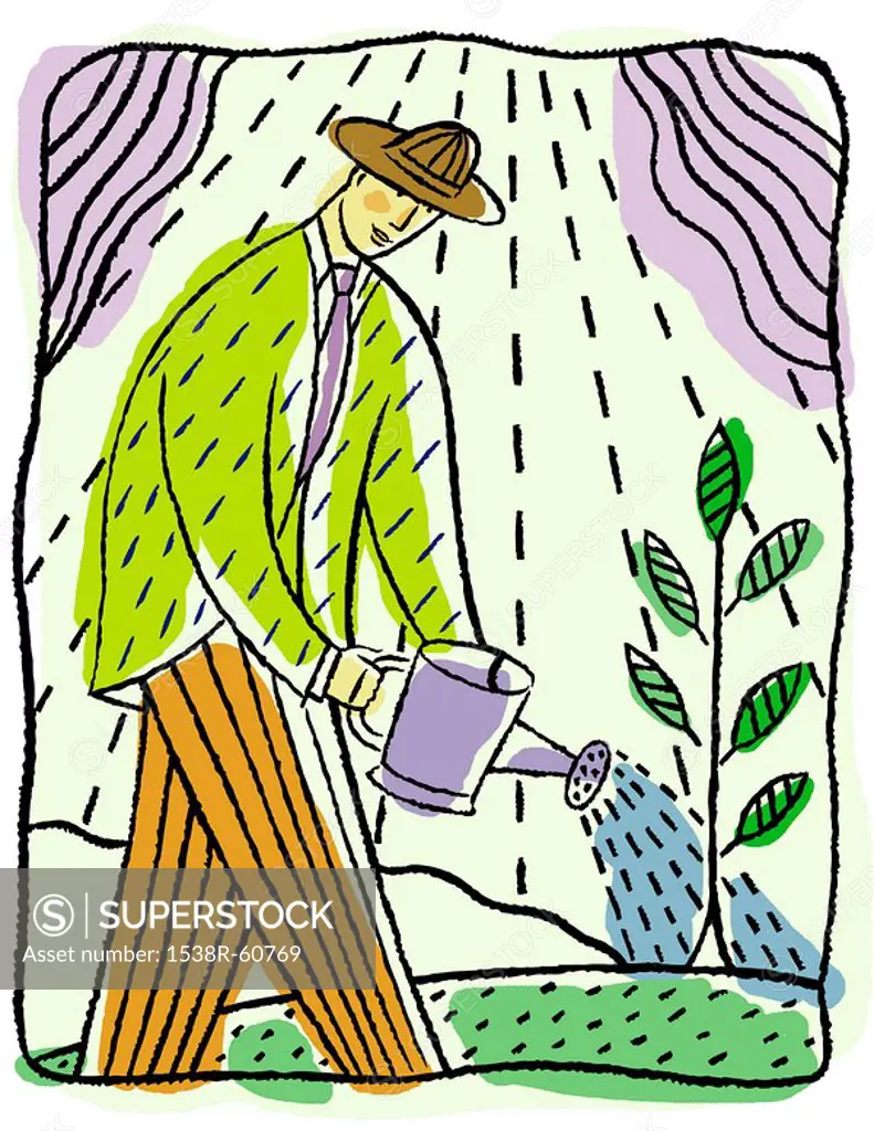 Man watering leafy plant