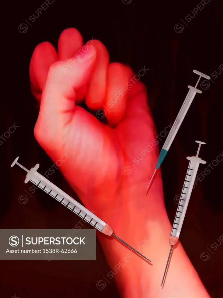 Clenched fist surrounded by syringes