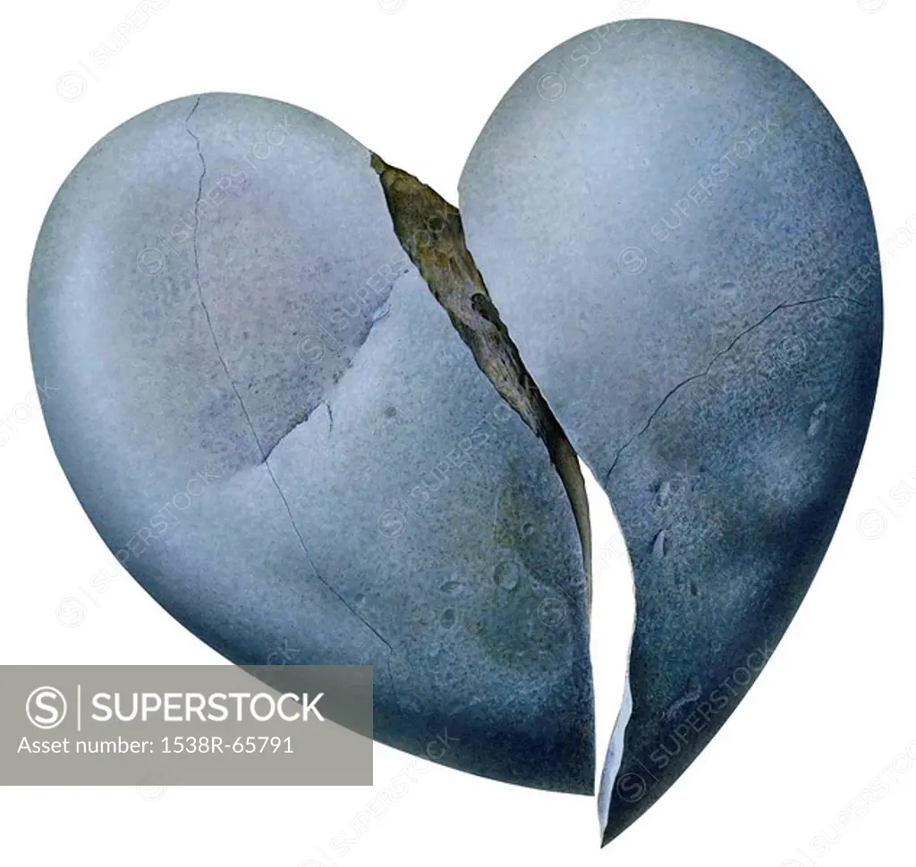 Broken heart shaped rock against white background