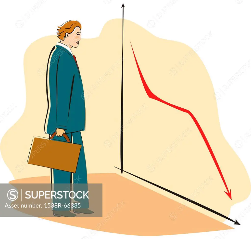 A businessman looking at a graph