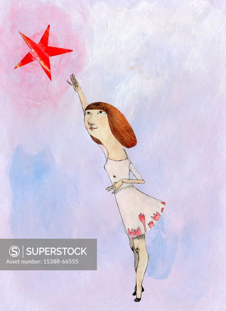 A young girl reaching for a star