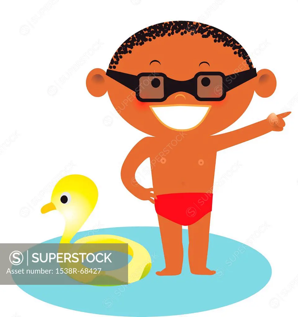 A boy standing in water near a rubber duck