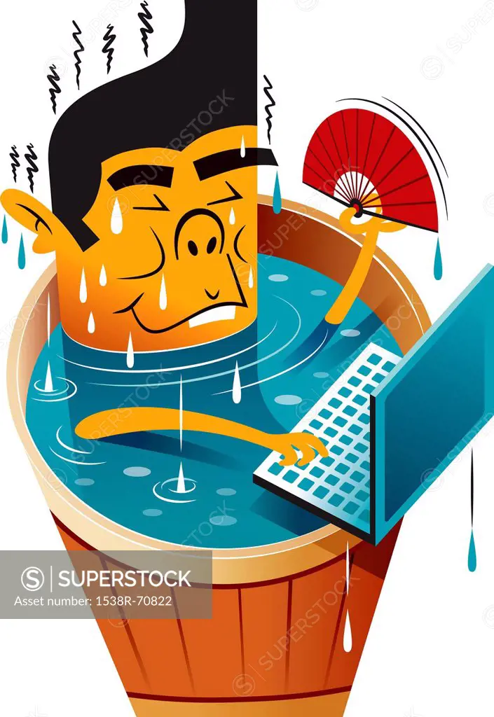A man in a hot tub working on his computer