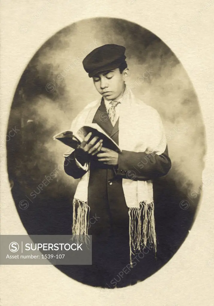 Close-up of a bar mitzvah reading a torah, c. 1915