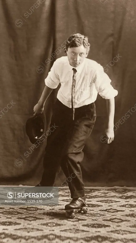 Portrait of a young man roller skating, c. 1908