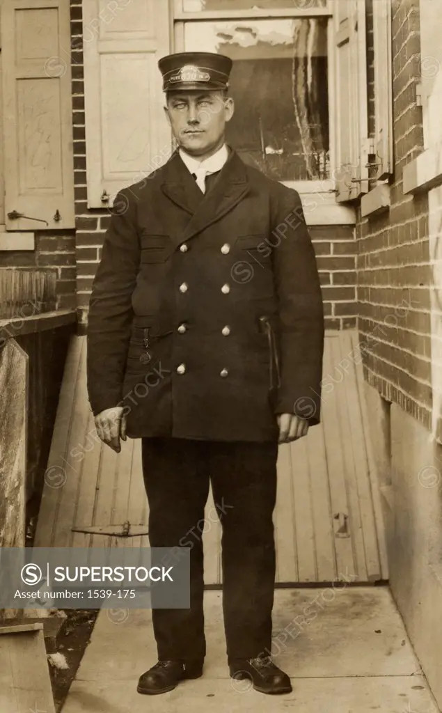 Young policeman standing, 1908