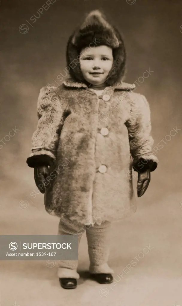 Portrait of a girl wearing a winter coat, c. 1910