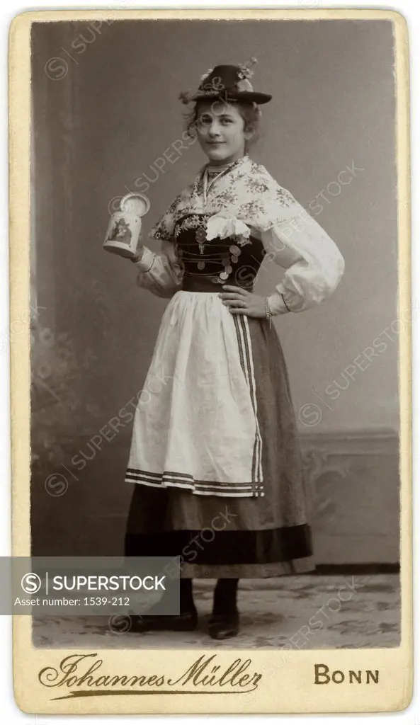 Side profile of a young woman holding a beer stein, Bonn, Germany, 1902