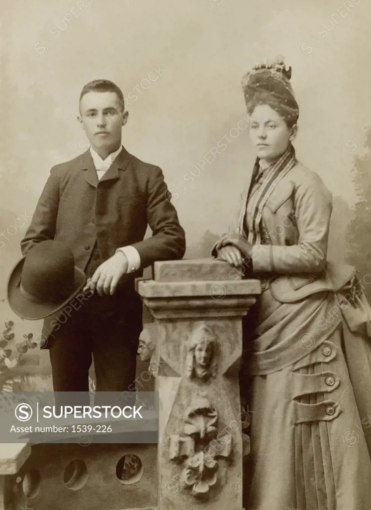 Young couple leaning against a pedestal, Indiana, USA, 1880