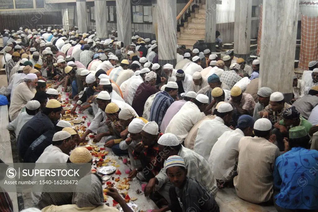 Muslims break their Ramzan or Ramadan fasting at Khatri Masjid in Pydhonie ; Bombay now Mumbai ; Maharashtra ; India  