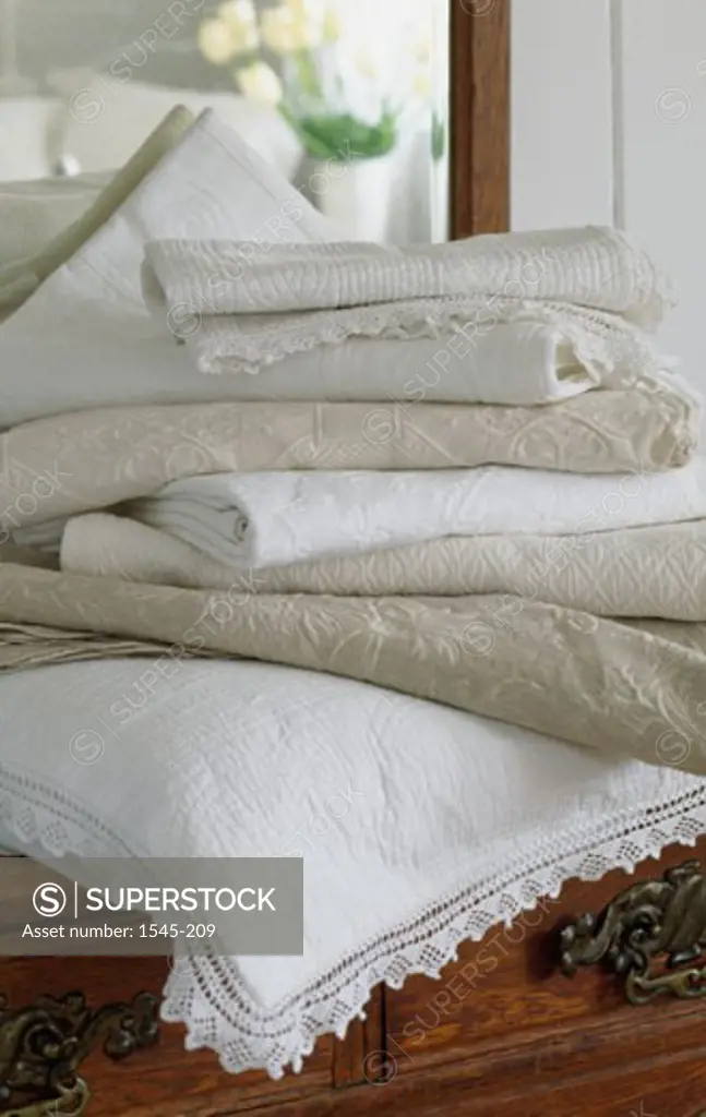 Close-up of a stack of bed sheets on a pillow