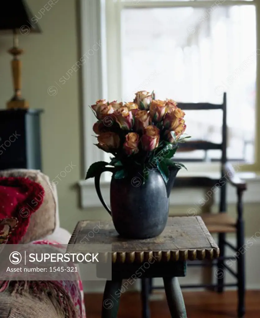 Flowers in a vase on a side table