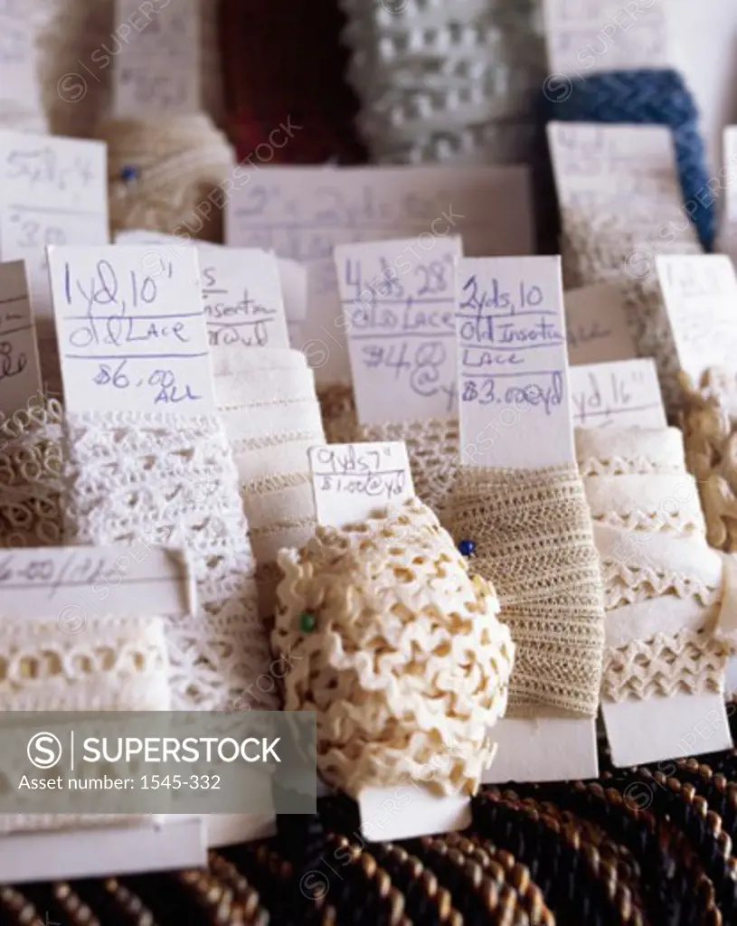 Close-up of rolls of lace with price tags