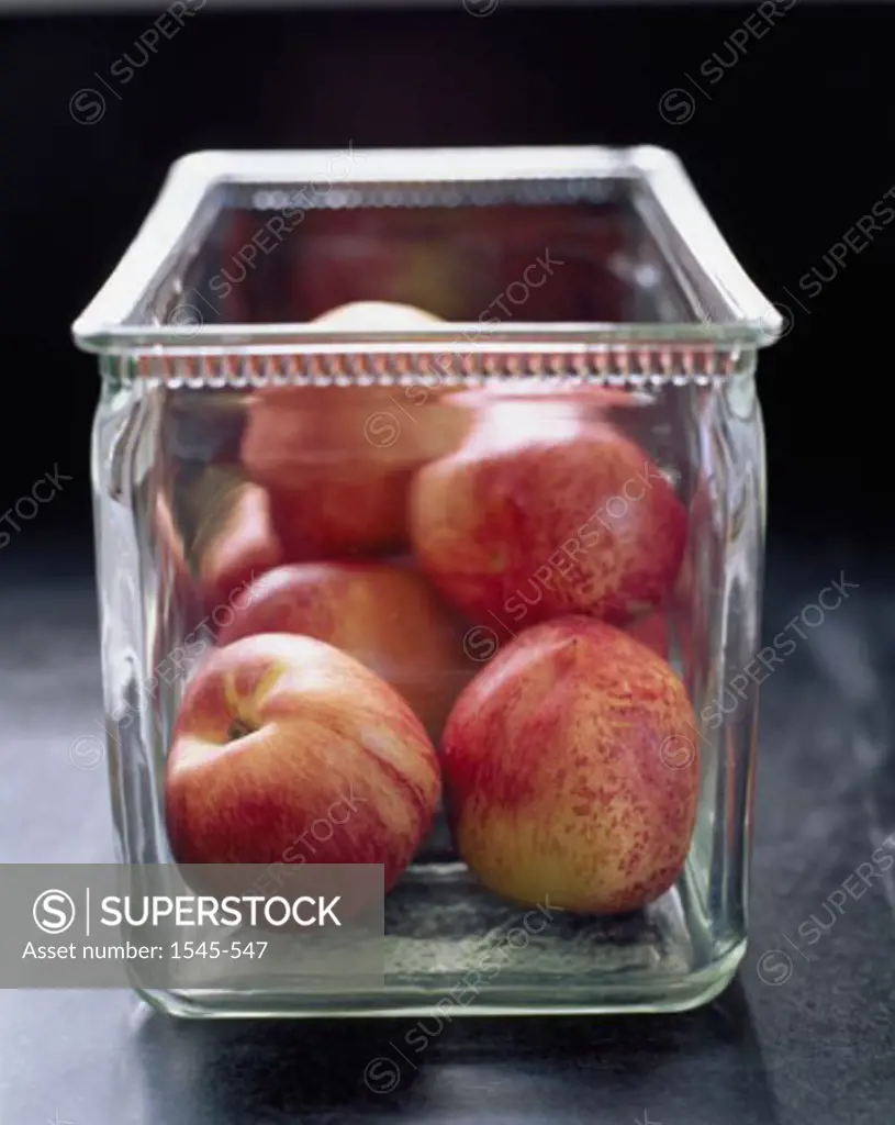 Close-up of apples in a container