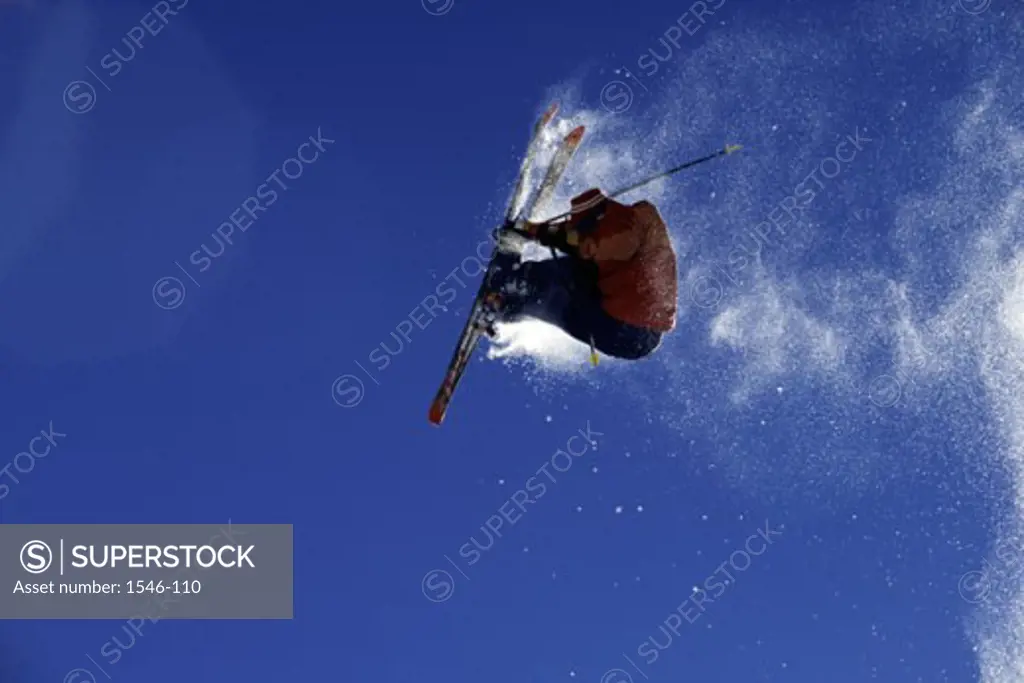 Low angle view of a skier in mid air
