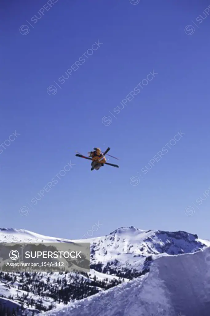 Low angle view of a skier in mid air
