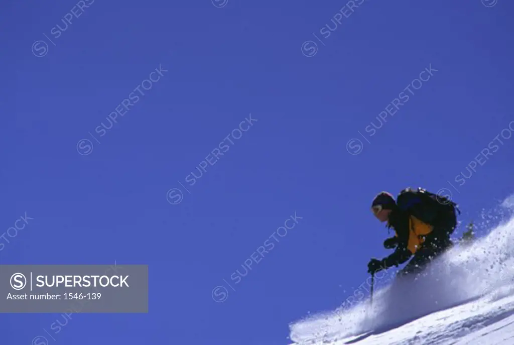 Side profile of a man skiing