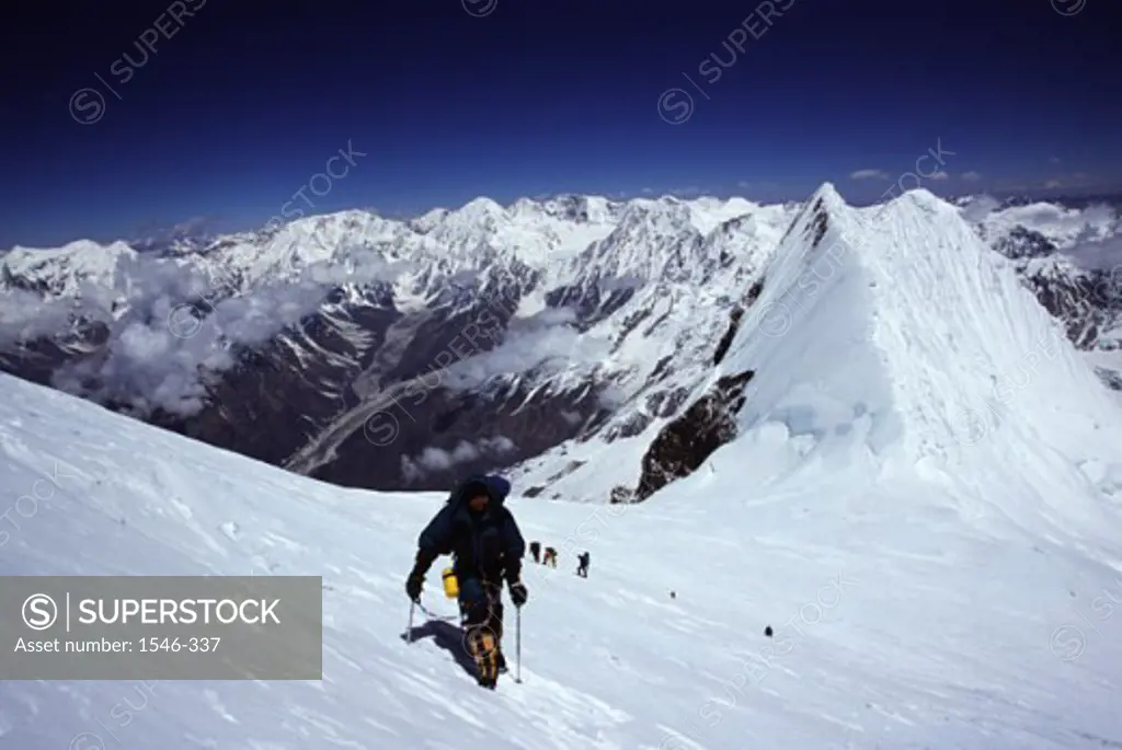 Rear view of a person climbing a mountain, Mount Manaslu, Nepal