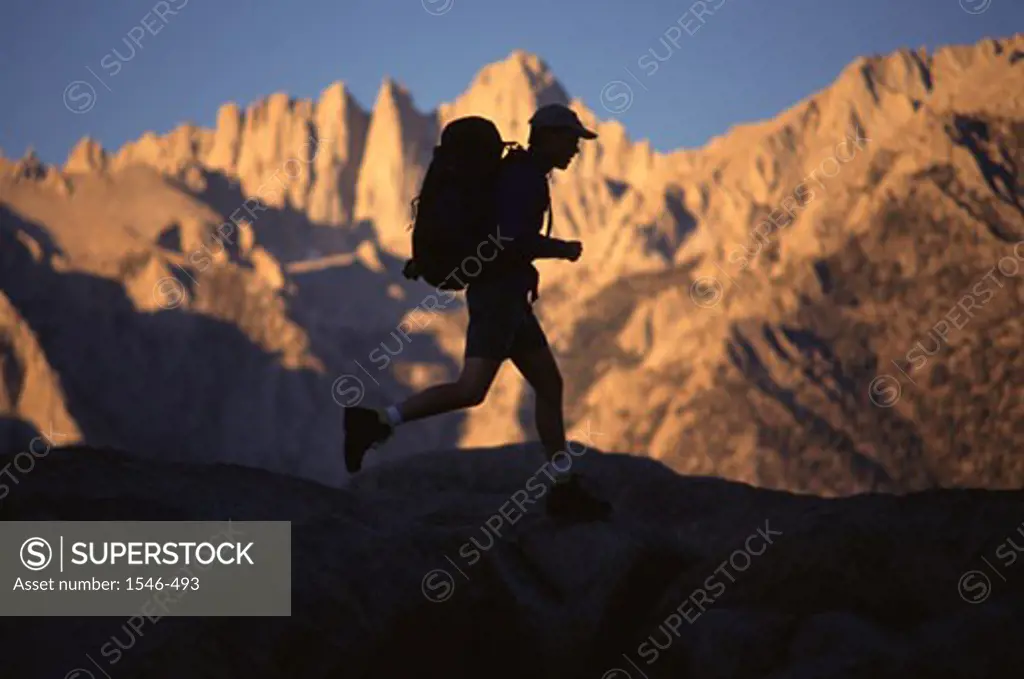 Silhouette of a man running on a mountain, Mount Whitney, Californian Sierra Nevada, California, USA