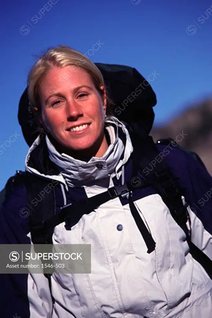 Portrait of a female hiker smiling, Californian Sierra Nevada, California, USA