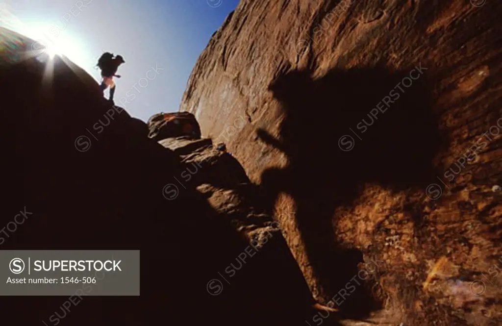 Man hiking on a mountain, Moab, Utah, USA