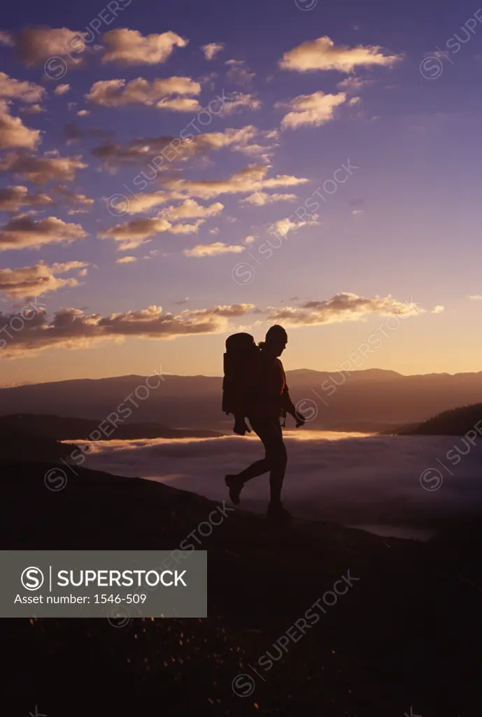 Silhouette of a woman hiking on a mountain, Donner Lake, Donner Summit, Truckee, California, USA