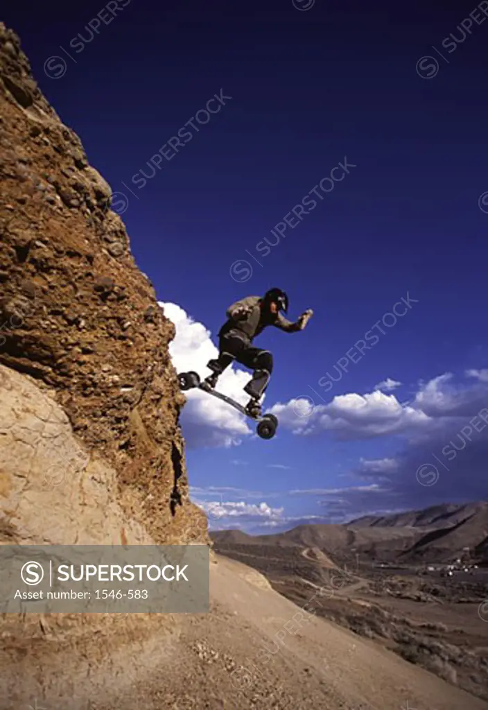 Low angle view of a man mountain boarding