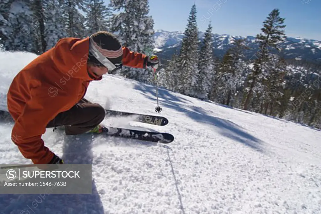 Side profile of a man skiing on snow, Lake Tahoe, California, USA