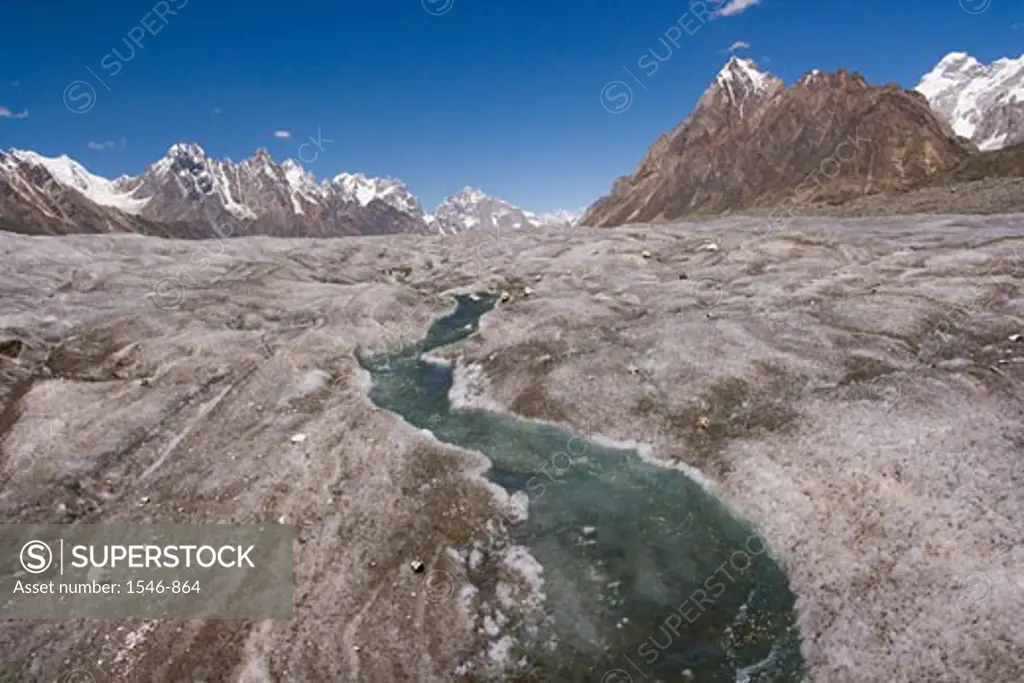 Frozen stream on the surface of glacial ice, Biafo Glacier, Karakoram Range, Pakistan