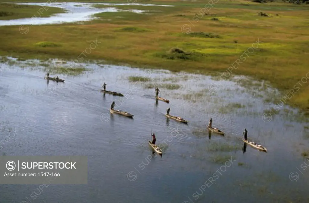 High angle view of a group of people punting boats, Okavango Delta, Botswana