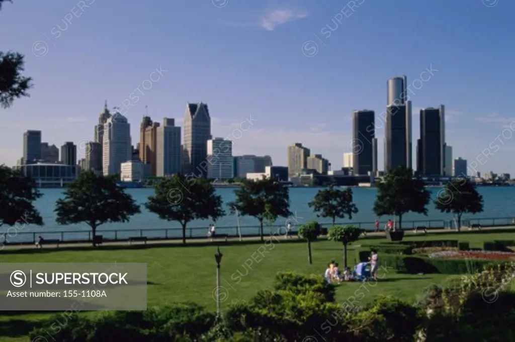 People at a park with buildings in the background, Detroit River, Renaissance Center, Detroit, Michigan, USA