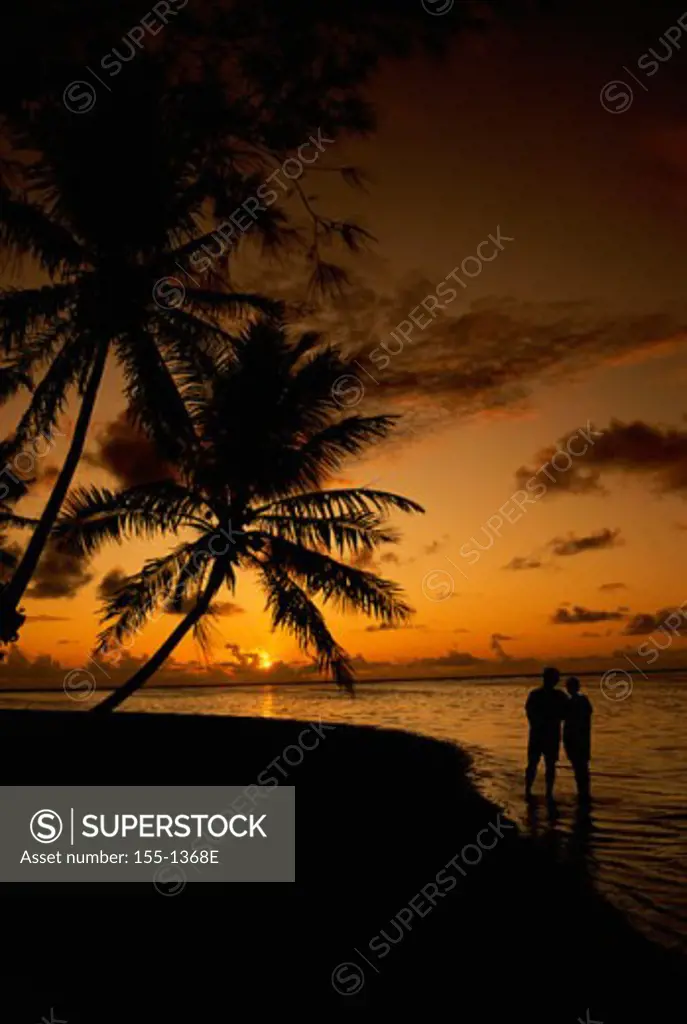 Silhouette of a couple on the beach, Tahiti, French Polynesia