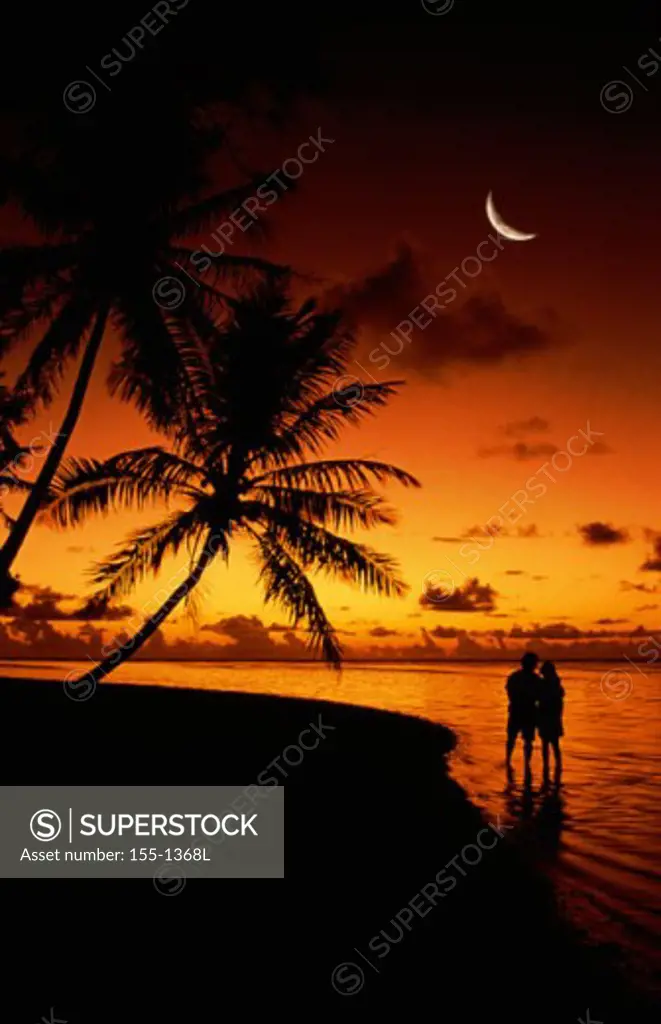 Silhouette of a couple on the beach, Tahiti, French Polynesia