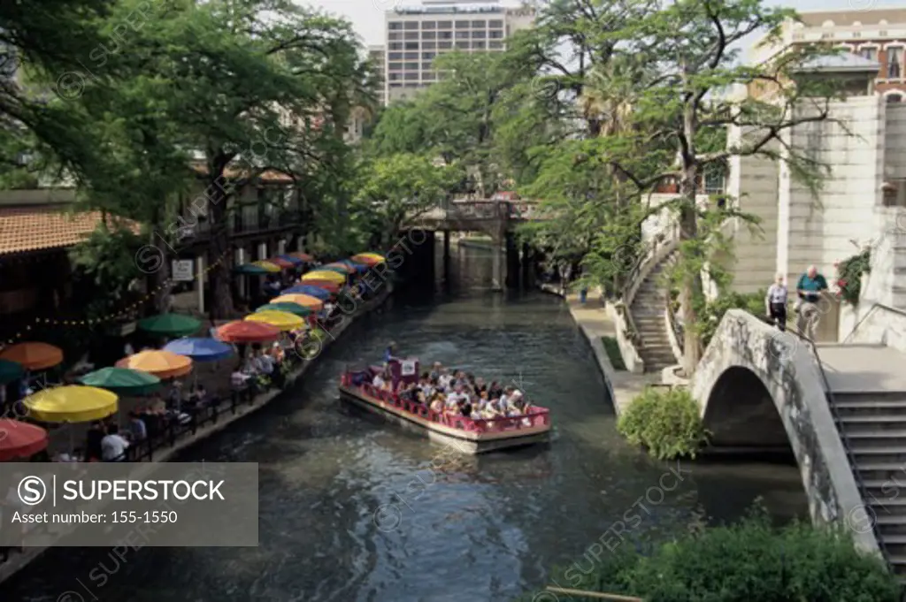 High angle view of tourists in a tourboat, San Antonio Riverwalk, San Antonio, Texas, USA