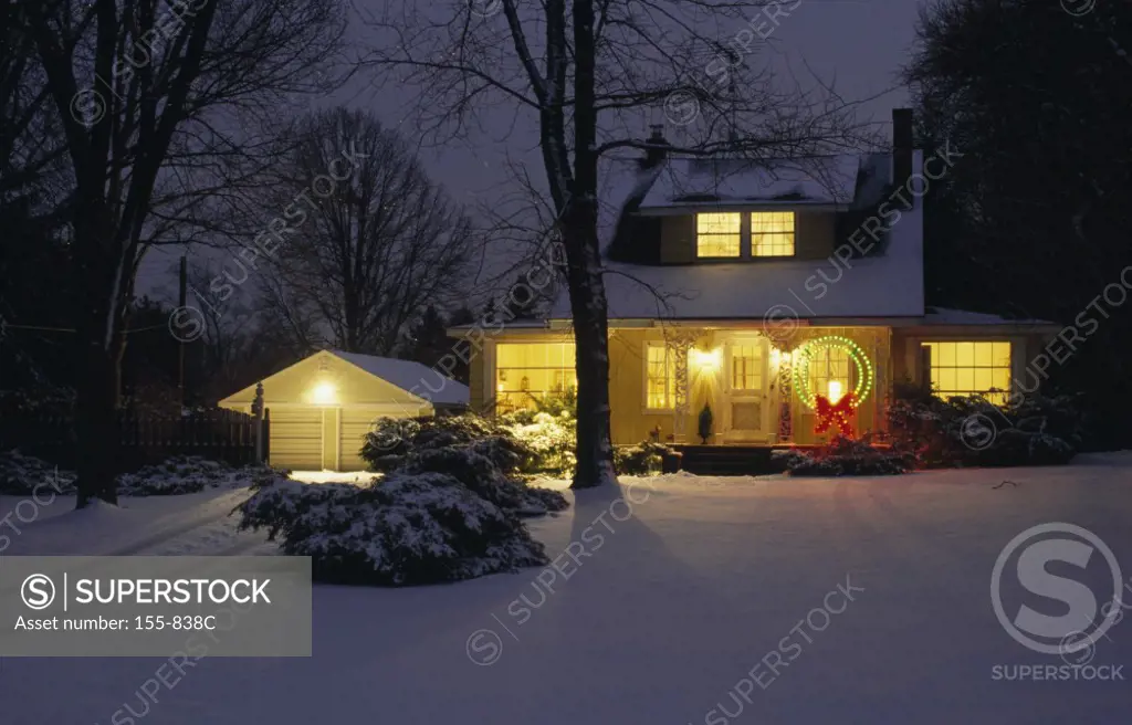 House lit up at night, Long Lake, Michigan, USA