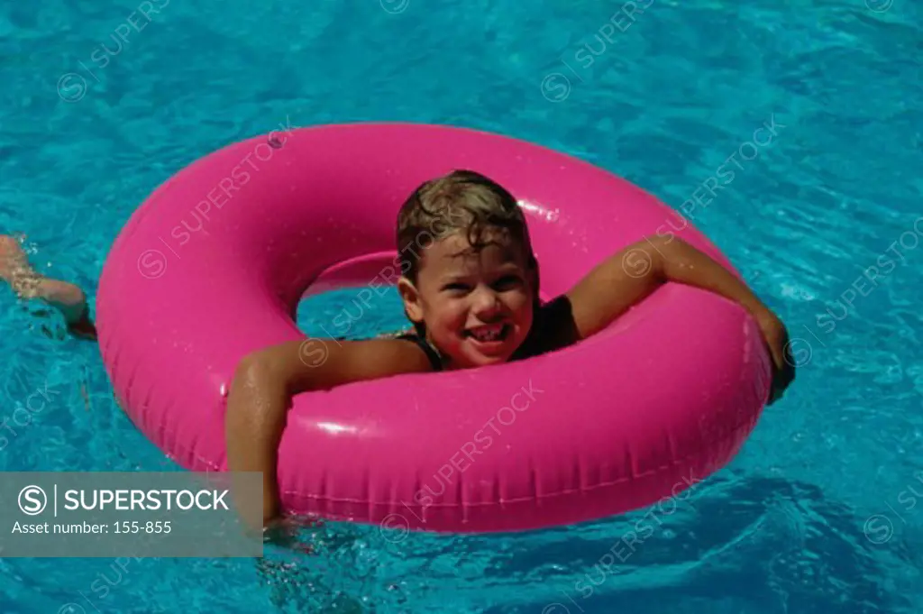 Girl swimming in a swimming pool