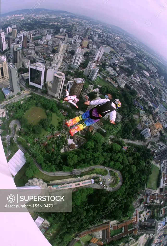 Two people base jumping, KL Tower, Kuala Lumpur, Malaysia