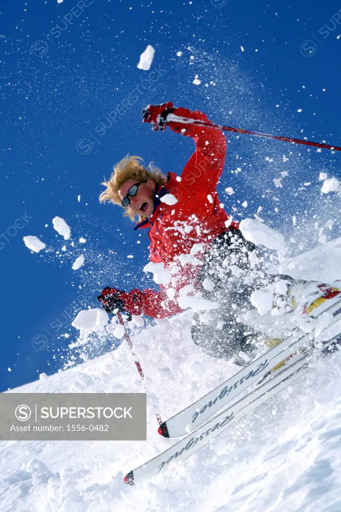 Woman skiing downhill, Chamonix, France