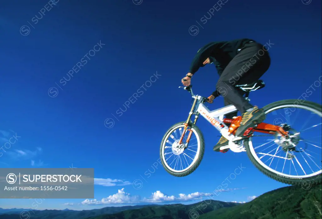 Person mountain biking
