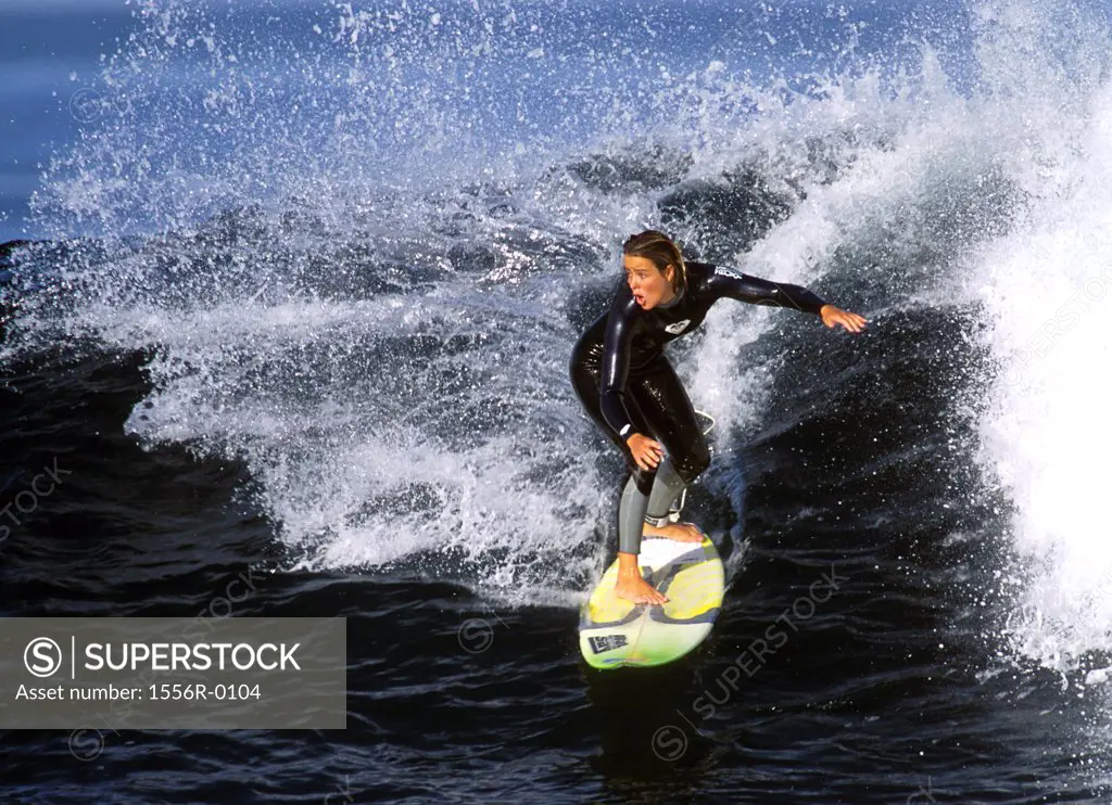 Young adult woman surfing, Lanzarote, Canary Islands