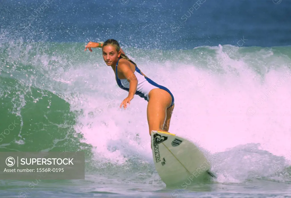 Young adult woman surfing, France
