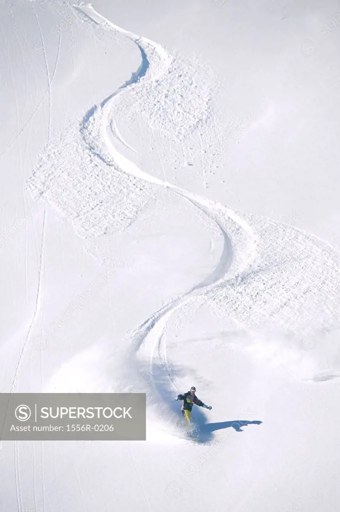 Person snowboarding downhill