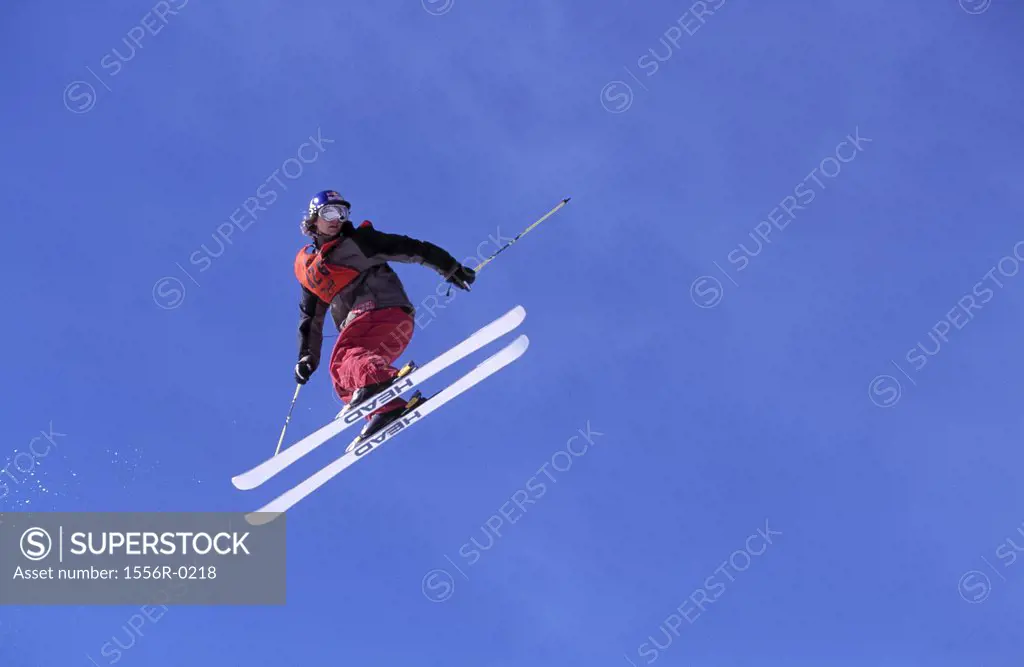 Person jumping backwards on skis