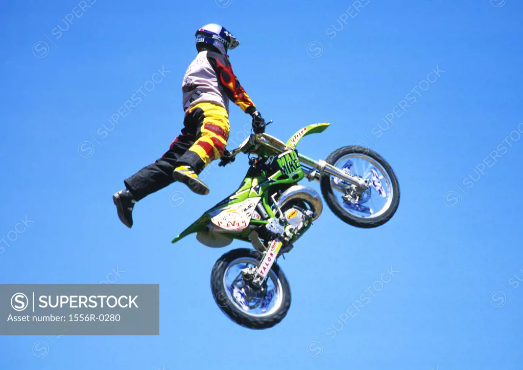 Person performing stunt on motorcycle