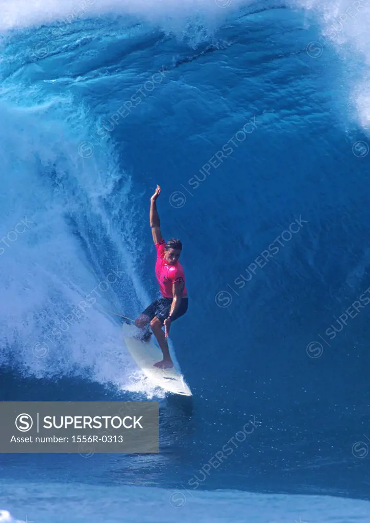 Young adult man surfing