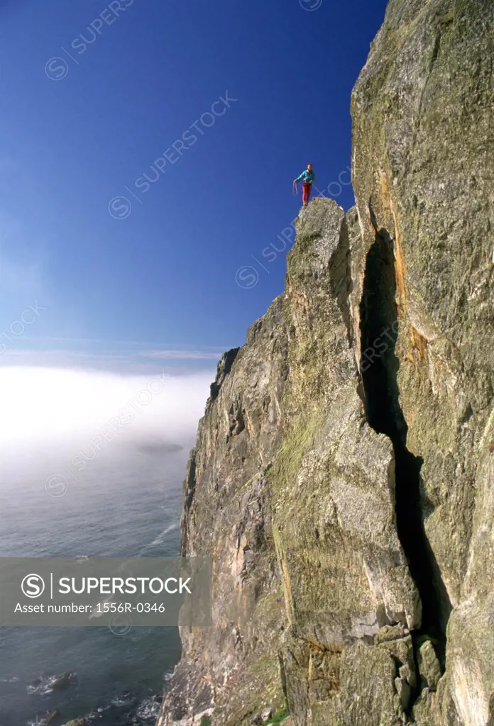 Person mountain climbing, Gogarth, Anglesey, Wales